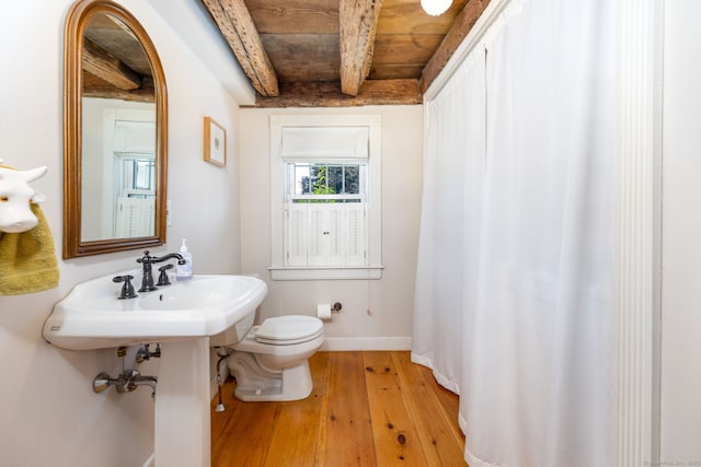 889 S Main St, Southington, CT 06479 - full bathroom with hardwood / wood-style floors, beam ceiling, and a shower with shower curtain