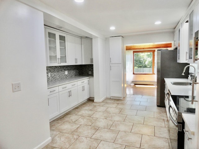 23 Norfolk Rd, Torrington, CT 06790 - kitchen featuring stainless steel electric stove, backsplash, white cabinetry, light countertops, and glass insert cabinets
