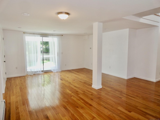 23 Norfolk Rd, Torrington, CT 06790 - spare room with light wood-type flooring and a baseboard radiator