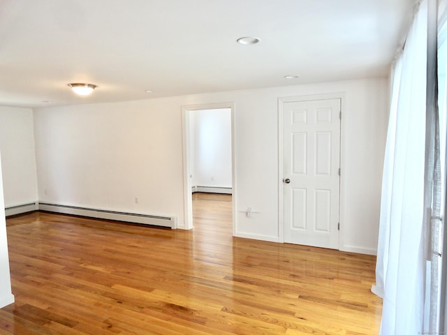23 Norfolk Rd, Torrington, CT 06790 - unfurnished room featuring baseboard heating, light wood-type flooring, recessed lighting, and a baseboard heating unit