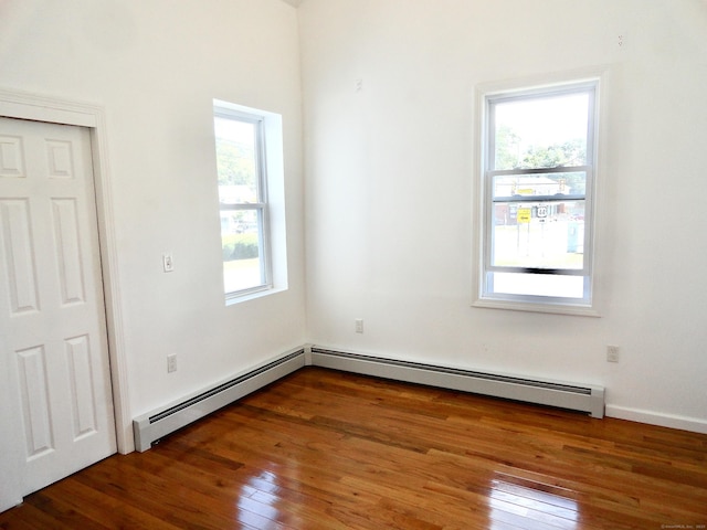 23 Norfolk Rd, Torrington, CT 06790 - unfurnished room with a baseboard heating unit and hardwood / wood-style floors
