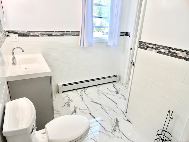 23 Norfolk Rd, Torrington, CT 06790 - half bath featuring baseboard heating, tile walls, marble look tile flooring, vanity, and a wainscoted wall