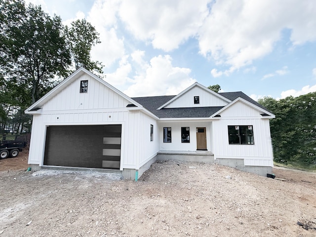 Lincoln St, Berlin, CT 06037 - modern farmhouse with an attached garage, roof with shingles, driveway, and covered porch