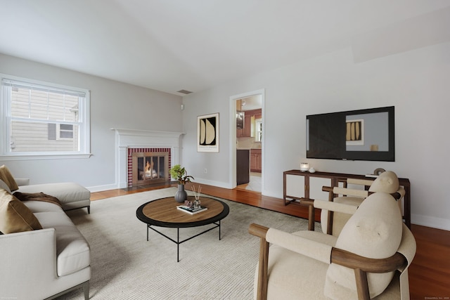 22 Brundage St, Stamford, CT 06907 - living room with light wood finished floors and a brick fireplace
