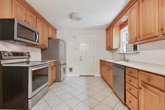 22 Brundage St, Stamford, CT 06907 - kitchen featuring appliances with stainless steel finishes, wallpapered walls, light countertops, and light tile patterned floors