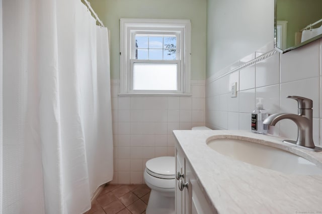 22 Brundage St, Stamford, CT 06907 - full bathroom with tile walls, tile patterned floors, vanity, a wainscoted wall, and curtained shower