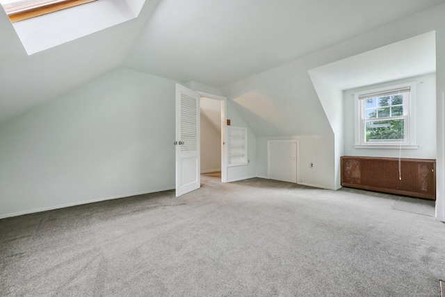 22 Brundage St, Stamford, CT 06907 - additional living space featuring vaulted ceiling, carpet flooring, and a skylight