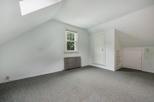 22 Brundage St, Stamford, CT 06907 - bonus room with radiator, vaulted ceiling, and carpet flooring