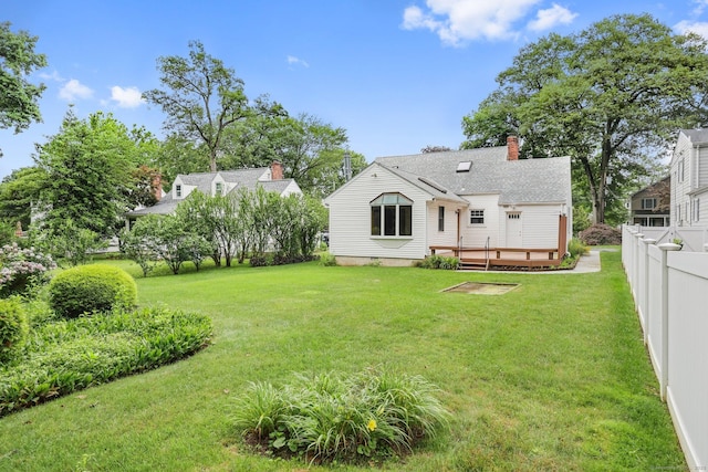22 Brundage St, Stamford, CT 06907 - rear view of property with a wooden deck and a chimney