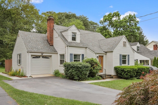 22 Brundage St, Stamford, CT 06907 - cape cod-style house featuring a chimney, an attached garage, driveway, and a shingled roof