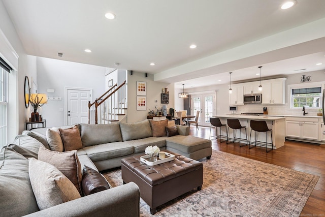 15 Wondy Way, Danbury, CT 06811 - living room with plenty of natural light, stairs, dark wood-style floors, recessed lighting, and french doors