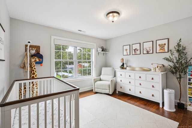15 Wondy Way, Danbury, CT 06811 - bedroom featuring a nursery area and dark wood-style floors