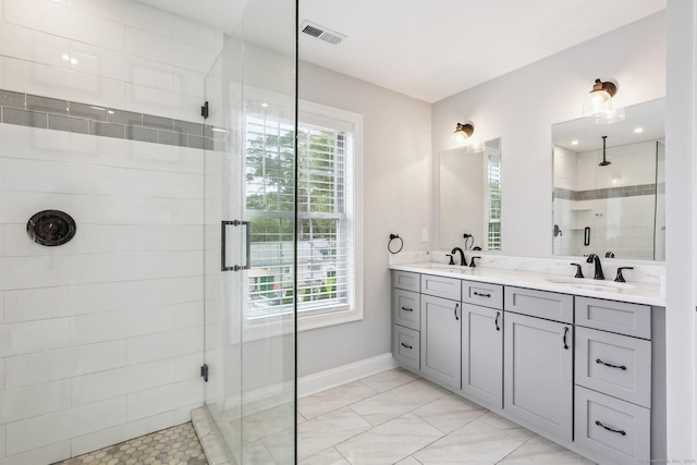 15 Wondy Way, Danbury, CT 06811 - bathroom with a shower stall, double vanity, and marble look tiles