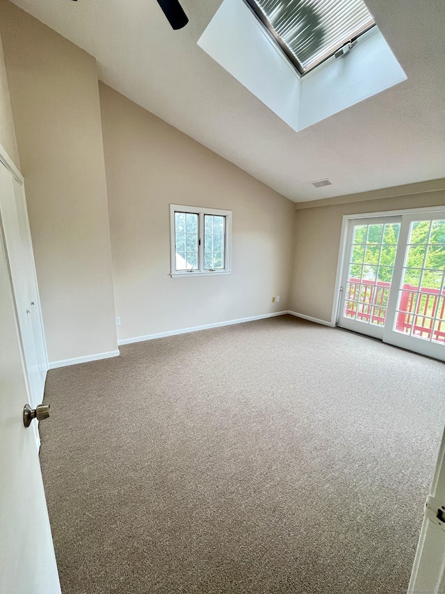 212 Clement Rd, East Hartford, CT 06118 - unfurnished room with carpet, a skylight, healthy amount of natural light, and lofted ceiling