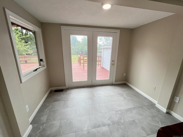 212 Clement Rd, East Hartford, CT 06118 - spare room featuring plenty of natural light and a textured ceiling