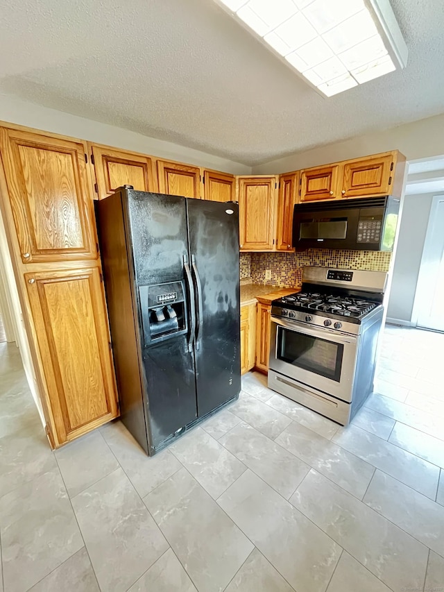 212 Clement Rd, East Hartford, CT 06118 - kitchen with black appliances, backsplash, and a textured ceiling