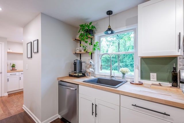 81 Burwell Rd, New Hartford, CT 06057 - kitchen with open shelves, stainless steel dishwasher, and butcher block countertops