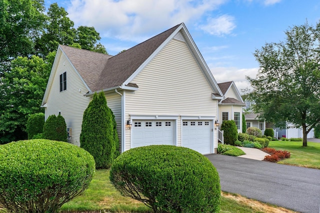 25 Quarry Ln Unit 25, Berlin, CT 06037 - view of home's exterior featuring roof with shingles, asphalt driveway, and a garage