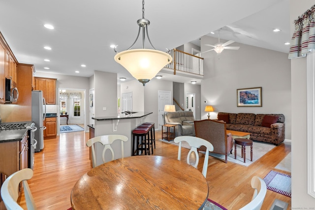 25 Quarry Ln Unit 25, Berlin, CT 06037 - dining area with light wood-style floors, a ceiling fan, recessed lighting, and vaulted ceiling