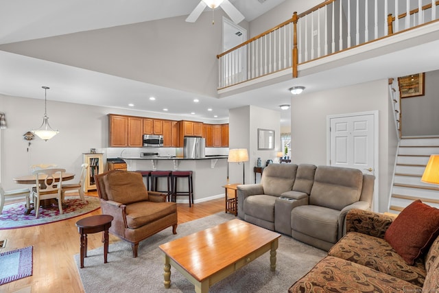 25 Quarry Ln Unit 25, Berlin, CT 06037 - living area with a towering ceiling, stairs, light wood finished floors, recessed lighting, and a ceiling fan