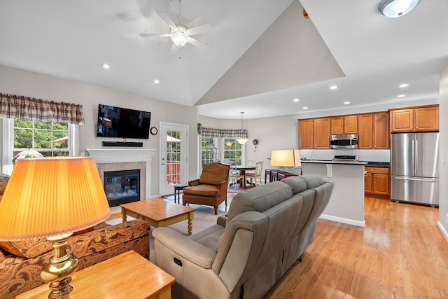 25 Quarry Ln Unit 25, Berlin, CT 06037 - living area with recessed lighting, plenty of natural light, light wood-style floors, a ceiling fan, and a fireplace