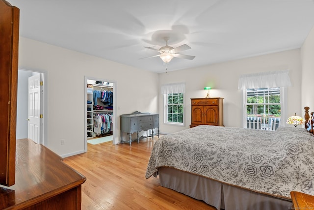 25 Quarry Ln Unit 25, Berlin, CT 06037 - bedroom featuring multiple windows, light wood-type flooring, a spacious closet, and a closet