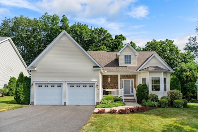 25 Quarry Ln Unit 25, Berlin, CT 06037 - view of front of property featuring asphalt driveway, a porch, a front lawn, roof with shingles, and a garage
