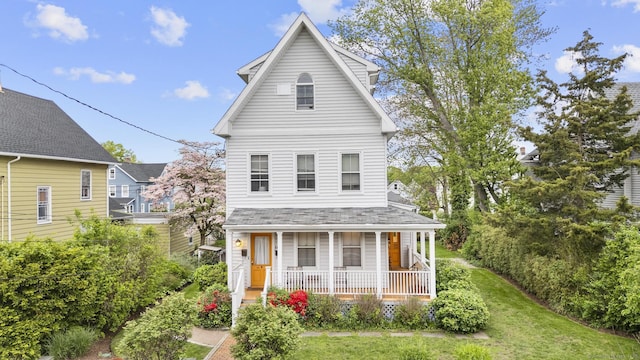 14 Jefferson St, Norwalk, CT 06851 - view of front of property featuring covered porch and a front lawn