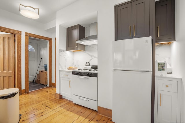 14 Jefferson St, Norwalk, CT 06851 - kitchen with white appliances, wall chimney range hood, backsplash, and light wood-type flooring