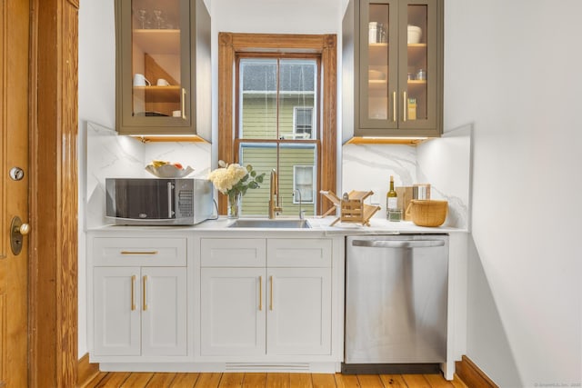 14 Jefferson St, Norwalk, CT 06851 - bar area featuring appliances with stainless steel finishes and tasteful backsplash