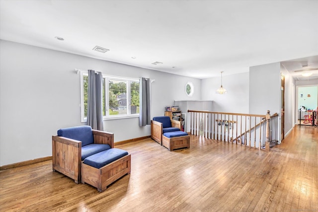 3 Old Hemlock Rd, Brookfield, CT 06804 - living area featuring light wood finished floors, an upstairs landing, and attic access