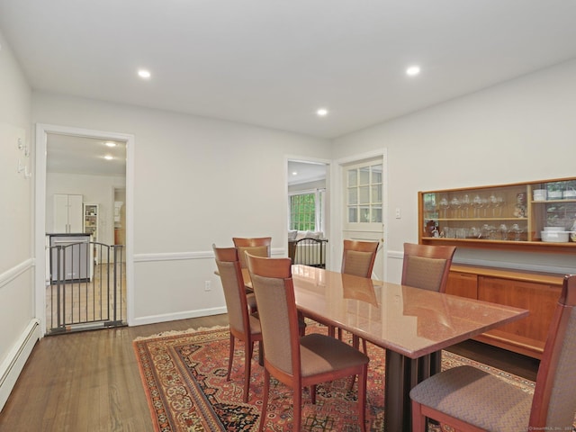 11 Dundee Rd, Stamford, CT 06903 - dining space featuring baseboard heating, dark wood finished floors, and recessed lighting