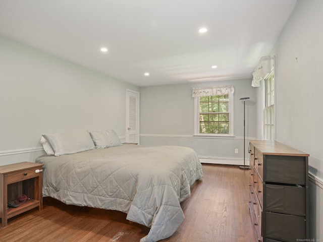 11 Dundee Rd, Stamford, CT 06903 - bedroom with baseboard heating, wood finished floors, and recessed lighting