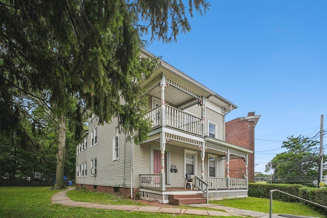 67 Whiting St, New Britain, CT 06051 - italianate house with a balcony, a porch, a front lawn, and a chimney