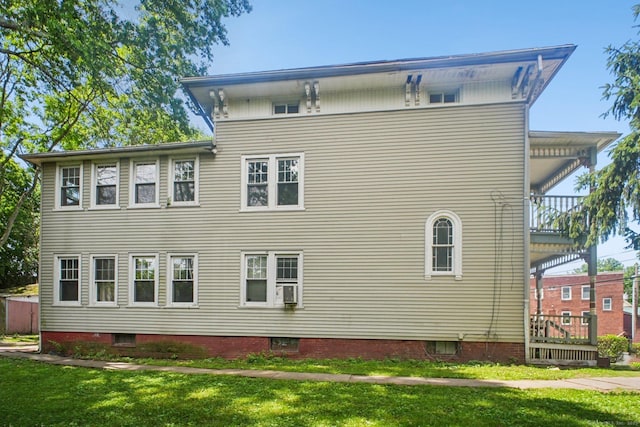 67 Whiting St, New Britain, CT 06051 - rear view of house featuring a balcony and a yard