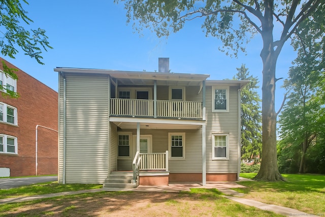 67 Whiting St, New Britain, CT 06051 - rear view of house with a balcony and a chimney