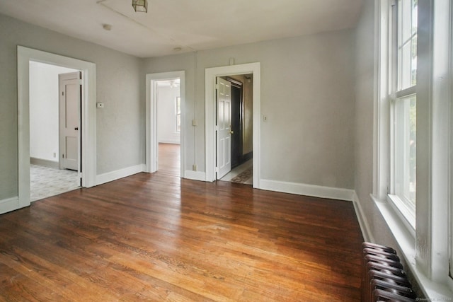 67 Whiting St, New Britain, CT 06051 - unfurnished room with radiator and wood finished floors