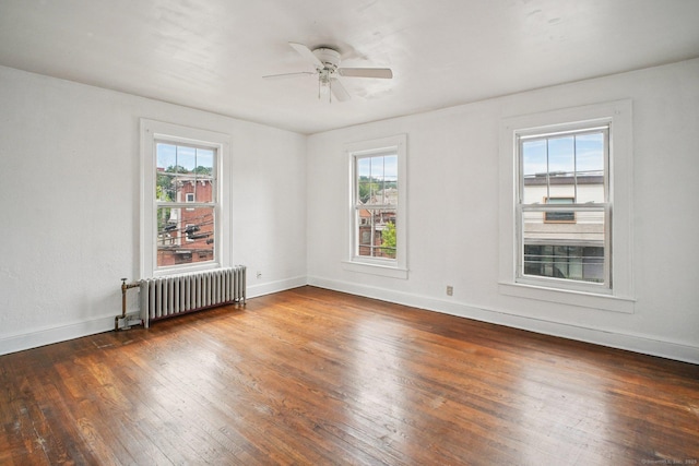 67 Whiting St, New Britain, CT 06051 - empty room with radiator heating unit, hardwood / wood-style flooring, and ceiling fan