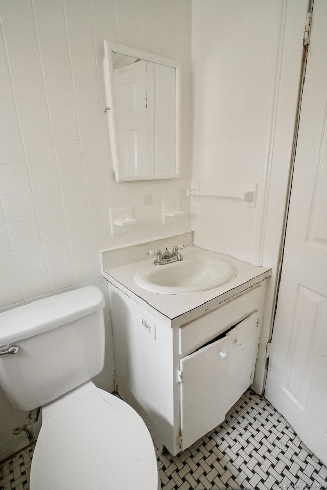 67 Whiting St, New Britain, CT 06051 - bathroom featuring vanity and tile walls