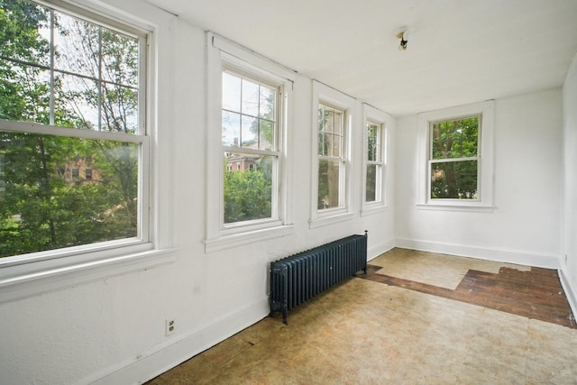 67 Whiting St, New Britain, CT 06051 - unfurnished sunroom featuring radiator heating unit and healthy amount of natural light