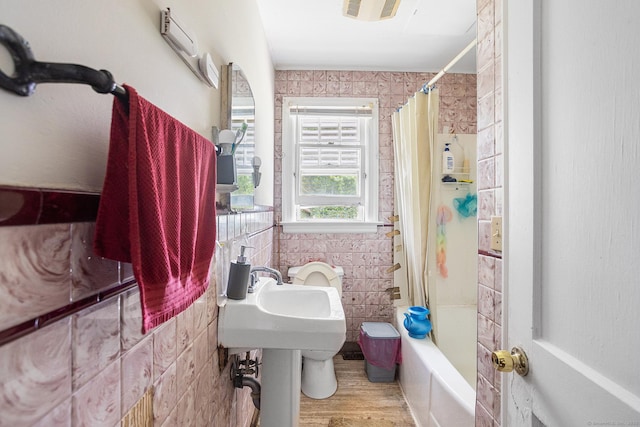 21 Harbor View Ave, Waterford, CT 06385 - bathroom featuring shower / tub combo with curtain, wood finished floors, and tile walls