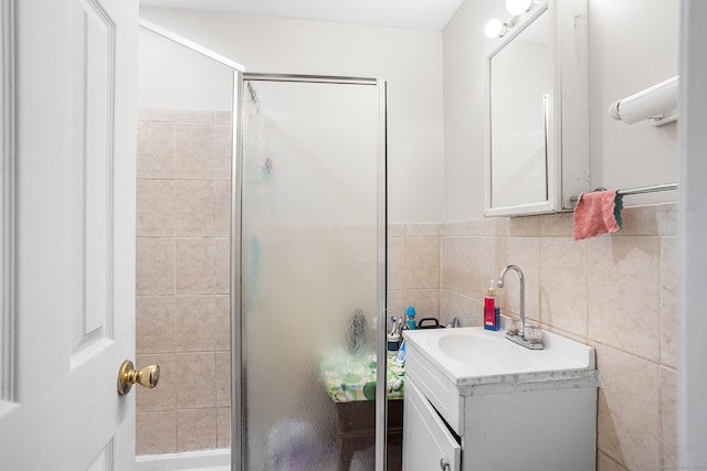 21 Harbor View Ave, Waterford, CT 06385 - bathroom featuring vanity, a stall shower, and tile walls