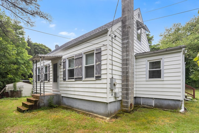 21 Harbor View Ave, Waterford, CT 06385 - view of side of property featuring a yard, a chimney, entry steps, and a pergola
