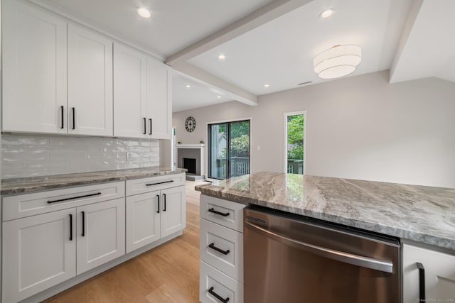 900 Heritage Vlg Unit B, Southbury, CT 06488 - kitchen with stainless steel dishwasher, light wood-style floors, decorative backsplash, white cabinetry, and light stone counters
