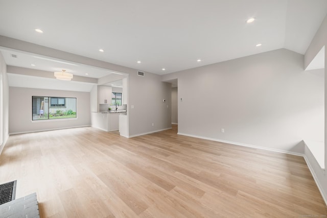 900 Heritage Vlg Unit B, Southbury, CT 06488 - unfurnished living room with light wood-style floors and recessed lighting