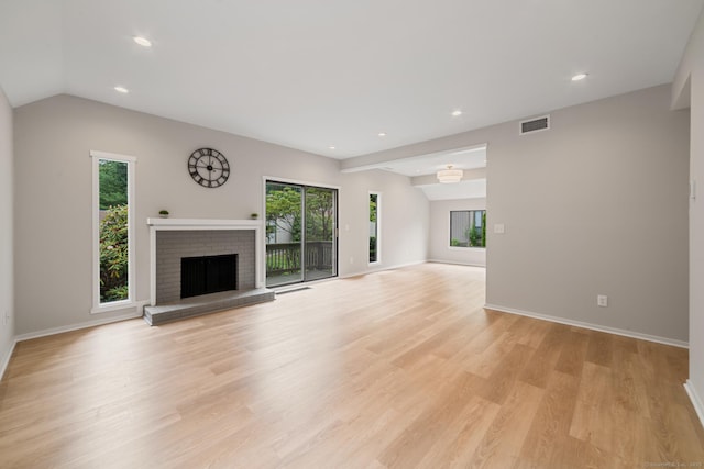 900 Heritage Vlg Unit B, Southbury, CT 06488 - unfurnished living room featuring healthy amount of natural light, a fireplace, light wood finished floors, recessed lighting, and lofted ceiling