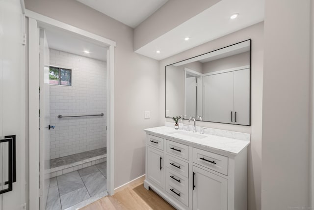900 Heritage Vlg Unit B, Southbury, CT 06488 - full bathroom with vanity, walk in shower, recessed lighting, and wood finished floors