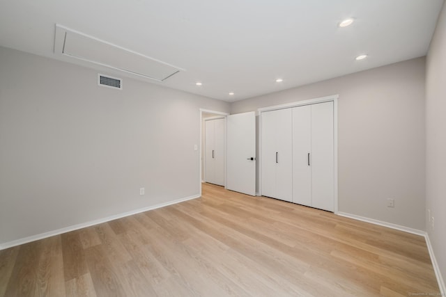 900 Heritage Vlg Unit B, Southbury, CT 06488 - unfurnished bedroom with attic access, light wood-style floors, recessed lighting, and a closet