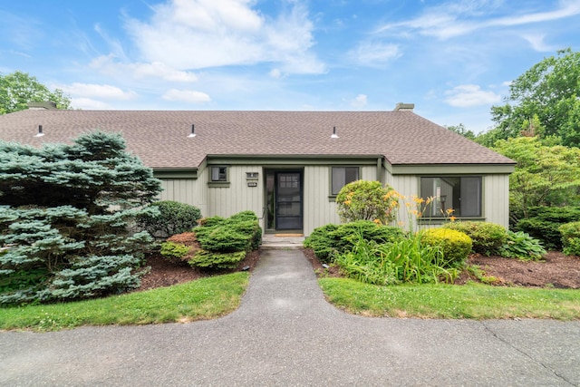 900 Heritage Vlg Unit B, Southbury, CT 06488 - view of front of home featuring a shingled roof and a chimney