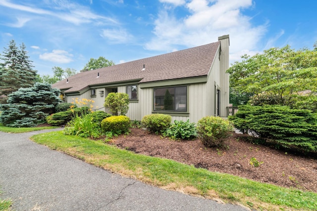 900 Heritage Vlg Unit B, Southbury, CT 06488 - view of front of home with roof with shingles, an attached garage, and a chimney